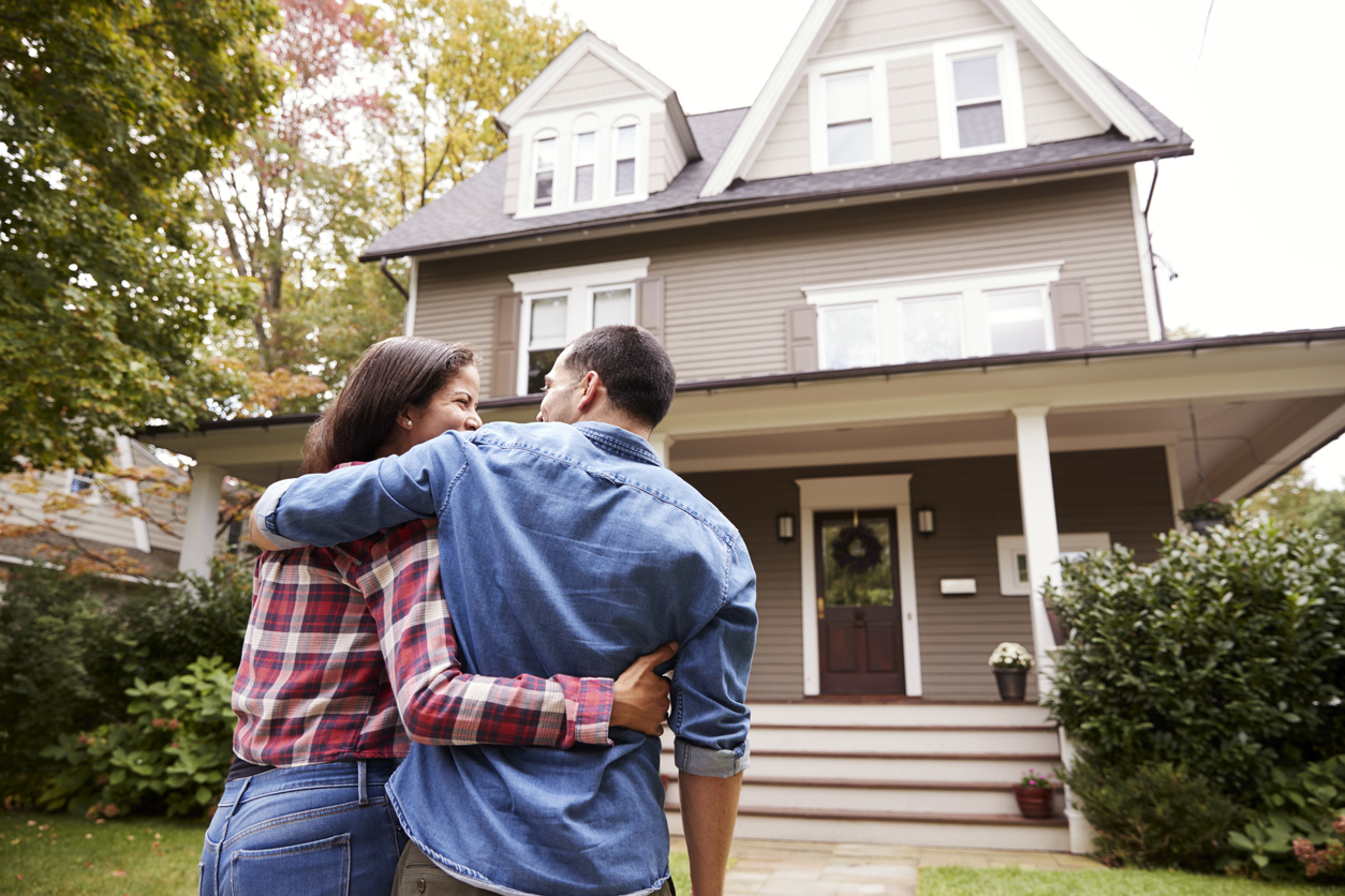 Rear View Of Loving Couple Walking Towards House